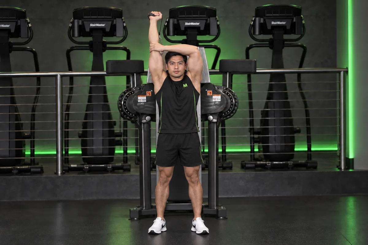 Standing Low-Pulley One-Arm Triceps Extension (End)