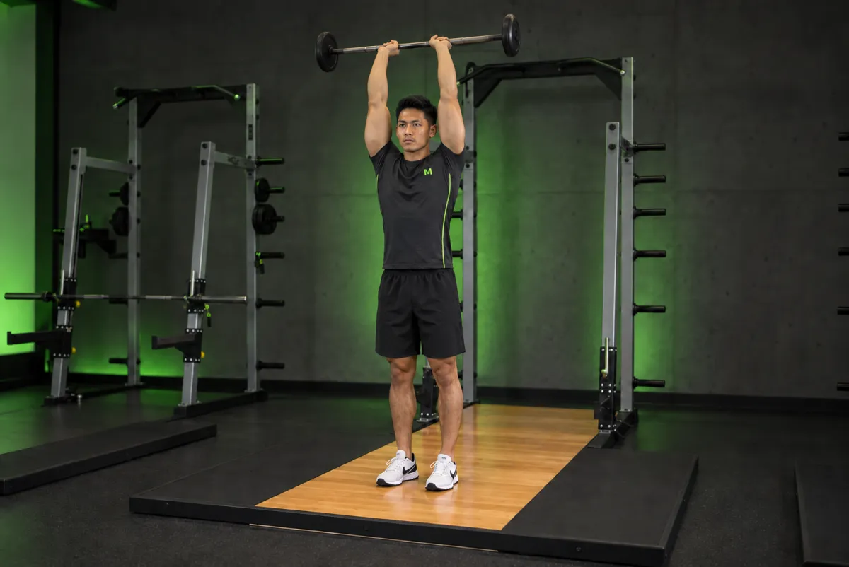 Duỗi tay sau qua đầu đứng với tạ đòn (Kết thúc)